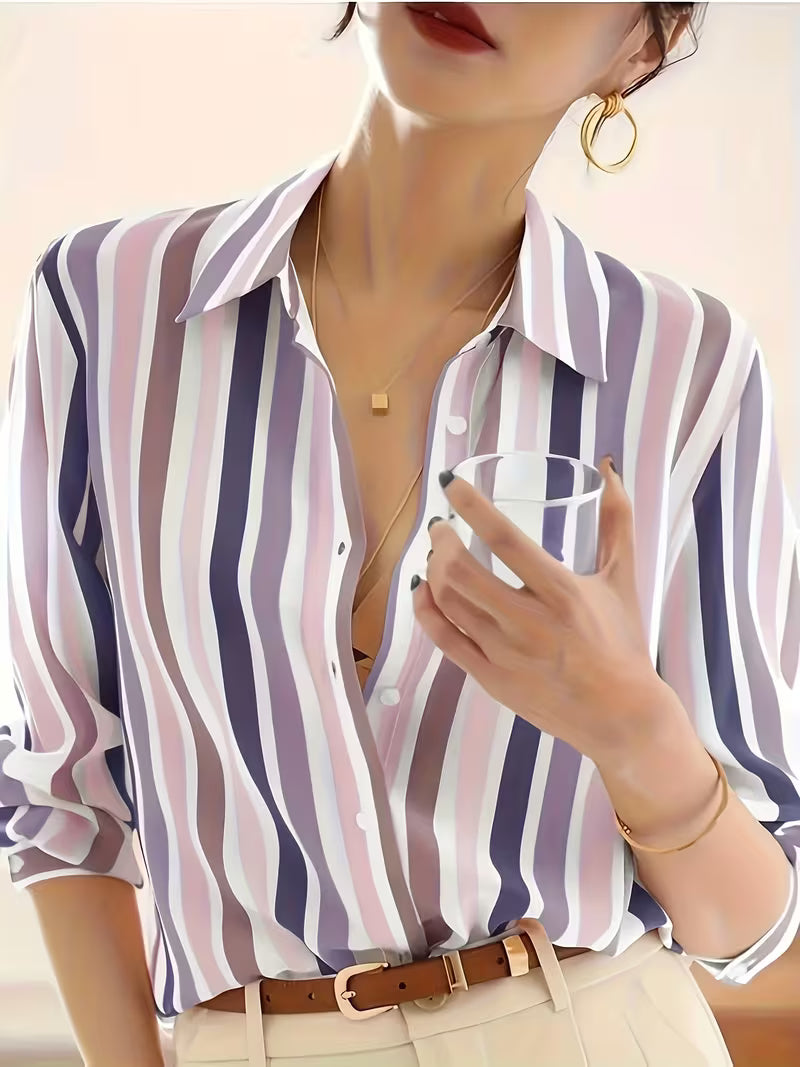 Women's blue and white striped button-up shirt. Versatile long-sleeve top for casual wear, office, or everyday fashion.