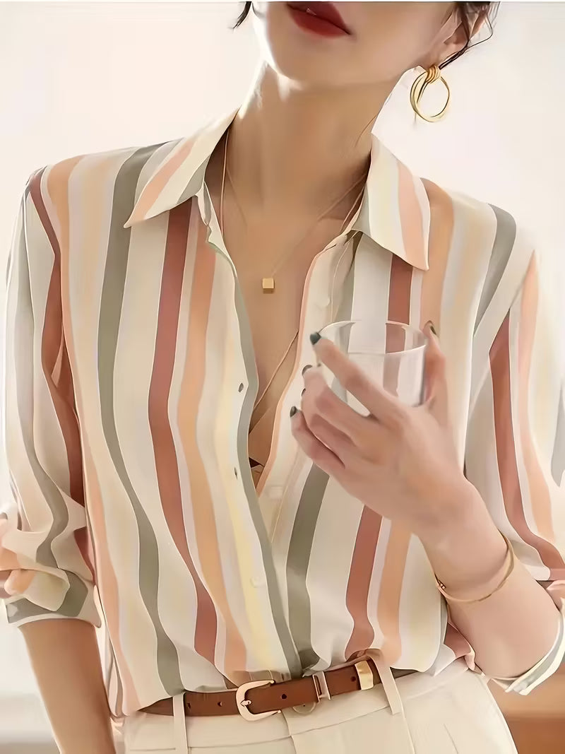 Chic women's striped button-up shirt with long sleeves. Everyday versatile collared top for work, office, or casual wear.
