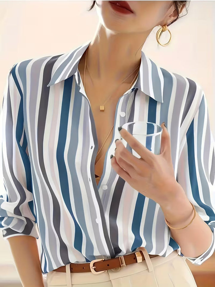 Stylish women's striped button-up shirt. Casual long-sleeve blouse with a relaxed fit, ideal for office or daily wear.
