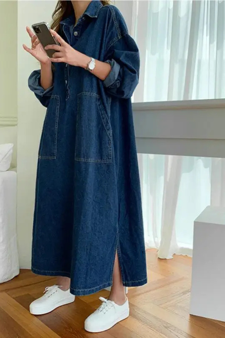 Close-up of a women's collared long sleeve blue maxi dress, highlighting pocket detail and soft fabric.
