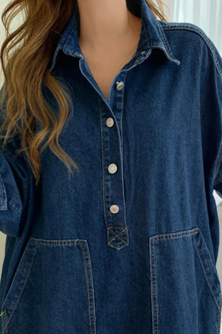 Stylish woman wearing a blue long sleeve collared maxi dress with pockets, ideal for transitional seasons.