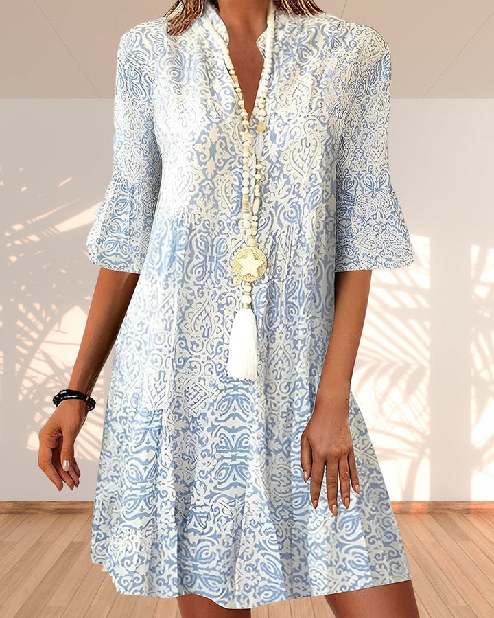 Women's blue floral boho midi dress with a flowing silhouette, perfect for summer casual and bohemian style.