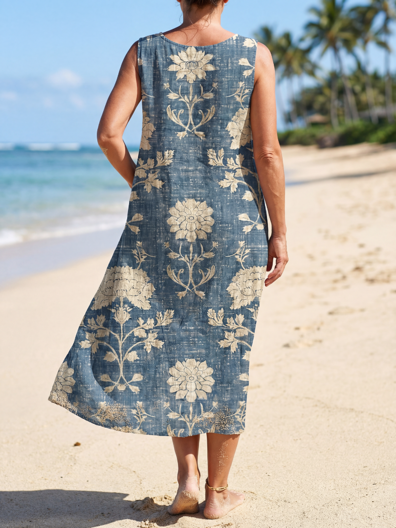 Relaxed women's floral midi dress in blue, ideal for summer. Sleeveless and comfortable everyday casual wear.