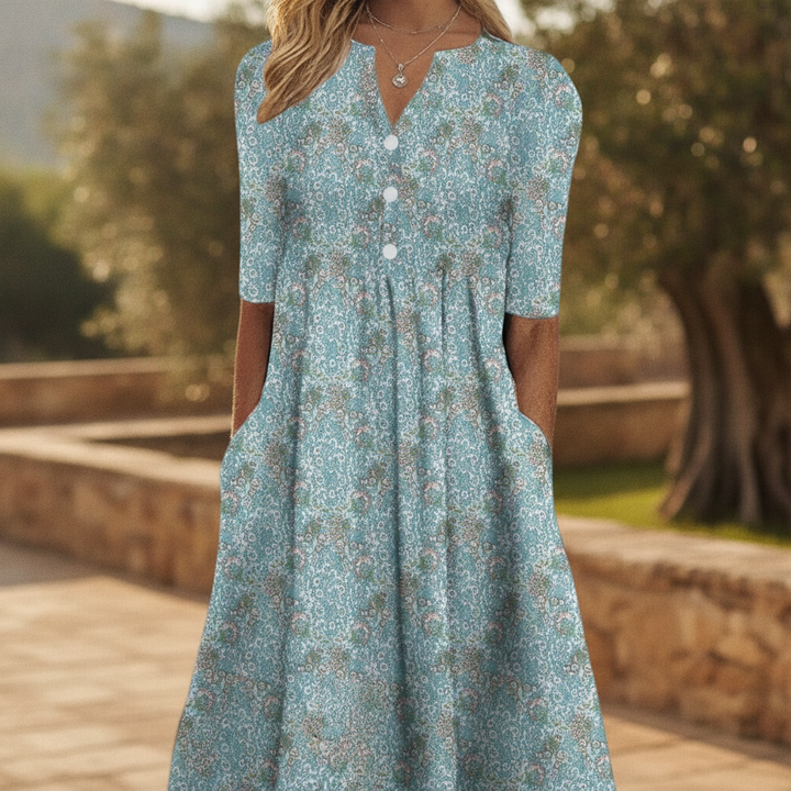 Women's blue floral print midi dress with functional buttons & handy pockets, perfect for casual spring/summer wear.
