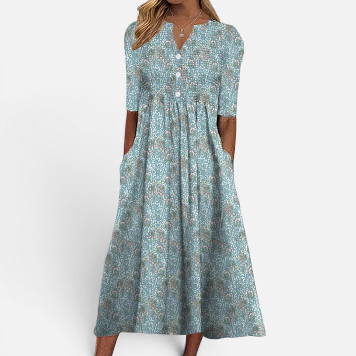 Elegant women's floral buttoned midi dress with practical pockets, ideal for versatile everyday spring and summer style.