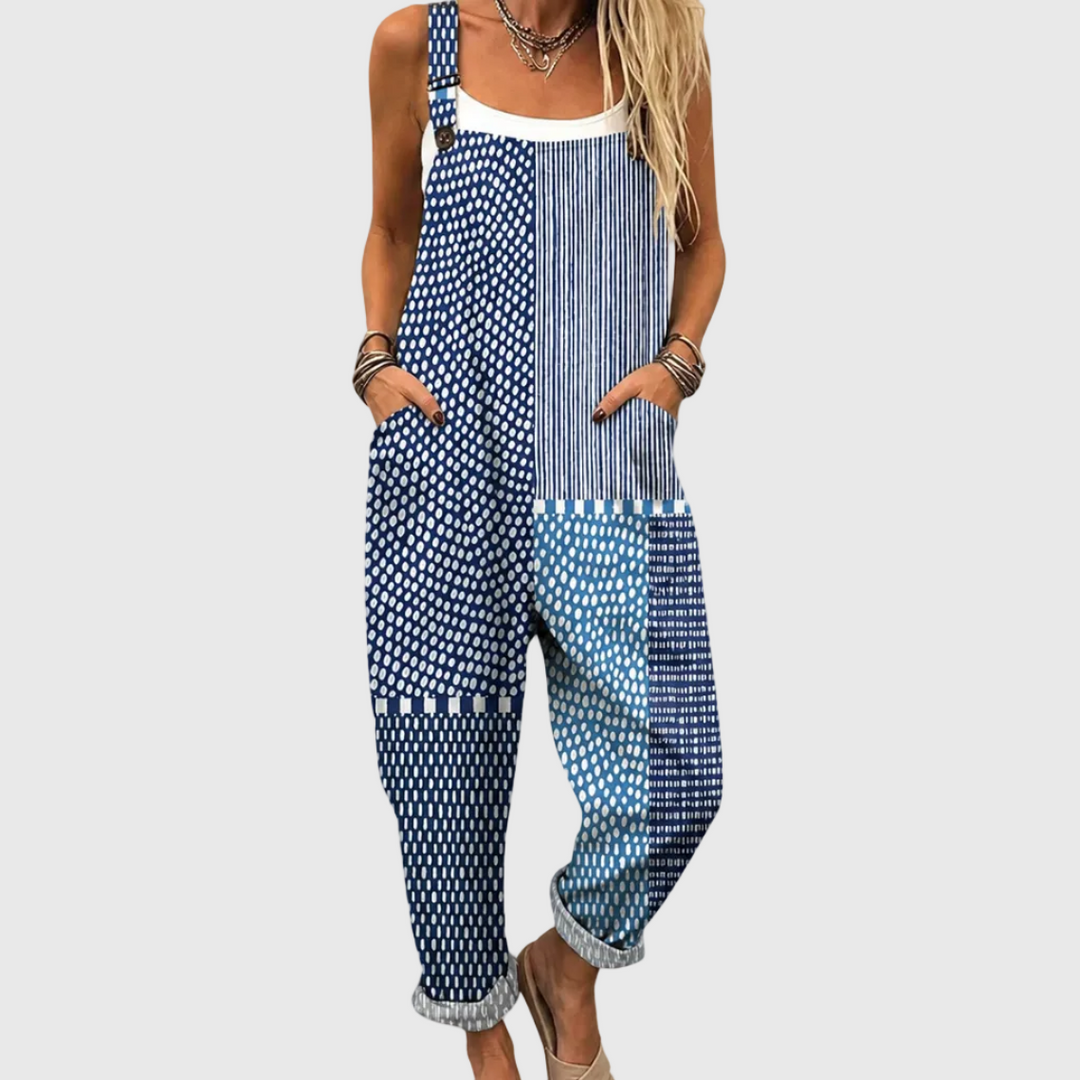 Women's blue printed jumpsuit with an artistic pattern, featuring a comfortable relaxed fit for casual summer wear.