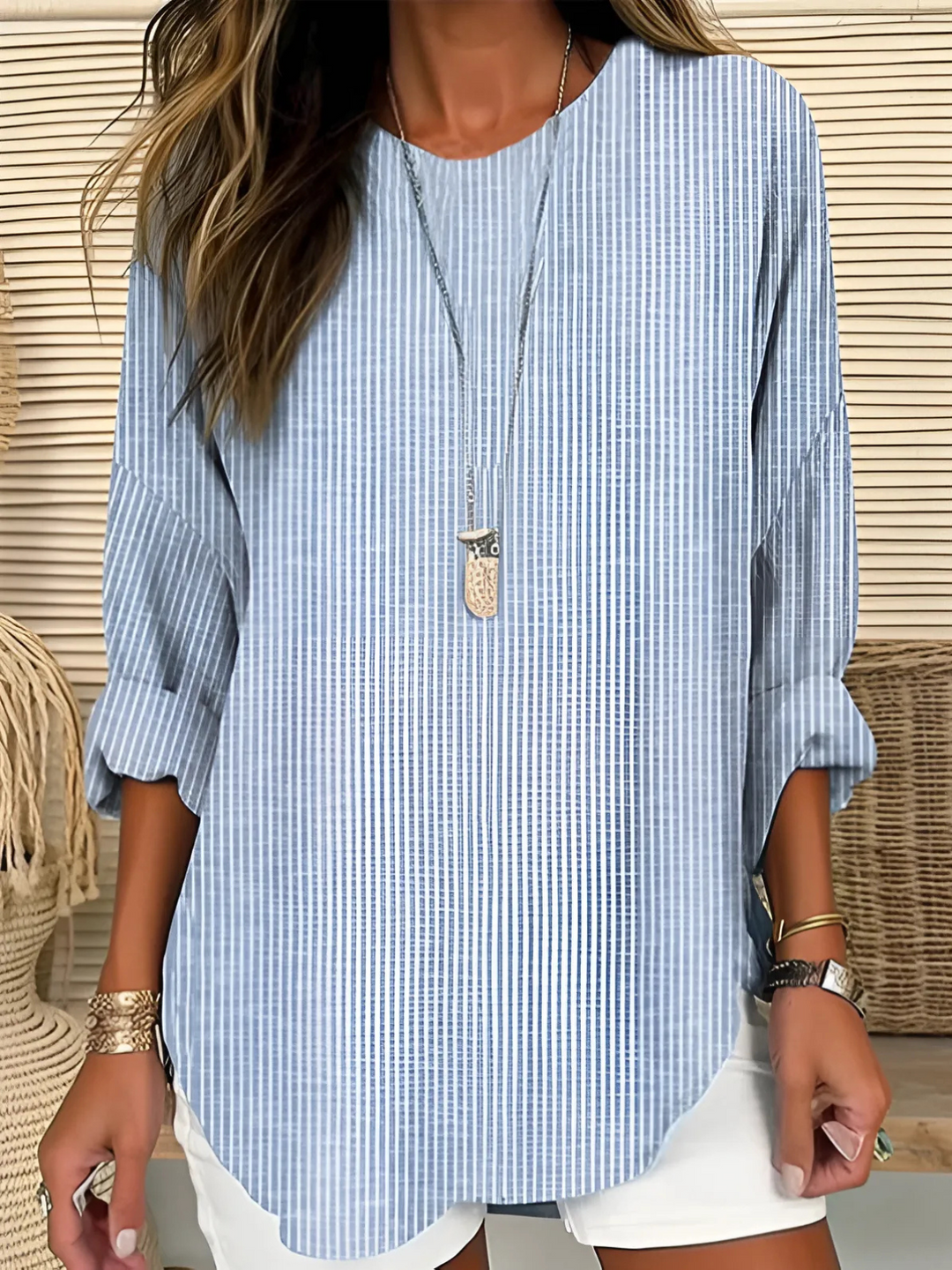 Women's blue striped blouse, relaxed fit, crew neck. Casual chic everyday wear, versatile fashion.