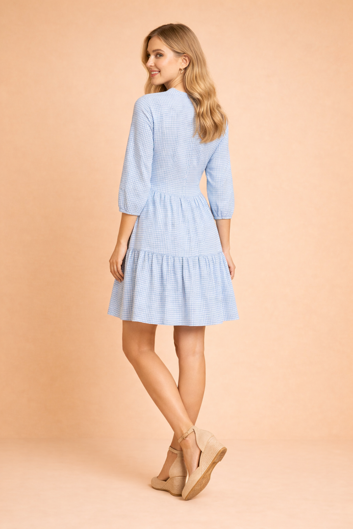 Elegant women's blue midi shirt dress with button-down detail. Ideal for summer, day to evening wear, and vacation.