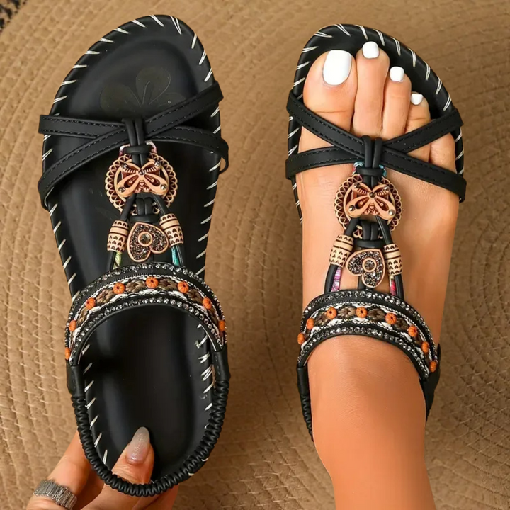 Embellished T-strap flat sandals for women, bohemian style for comfortable, chic summer holiday wear.