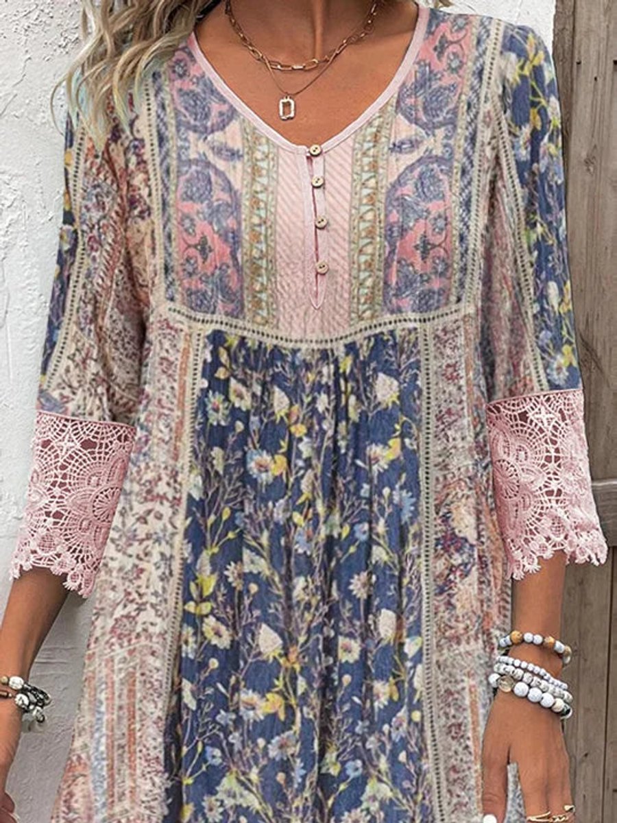 Women's bohemian floral tunic dress with lace trim, empire waist, and three-quarter sleeves, perfect for summer.