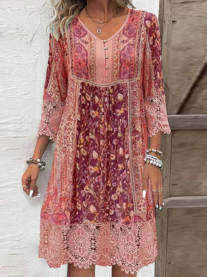 Elegant women's floral bohemian dress with delicate lace trim, three-quarter sleeves, and a flattering empire waist.