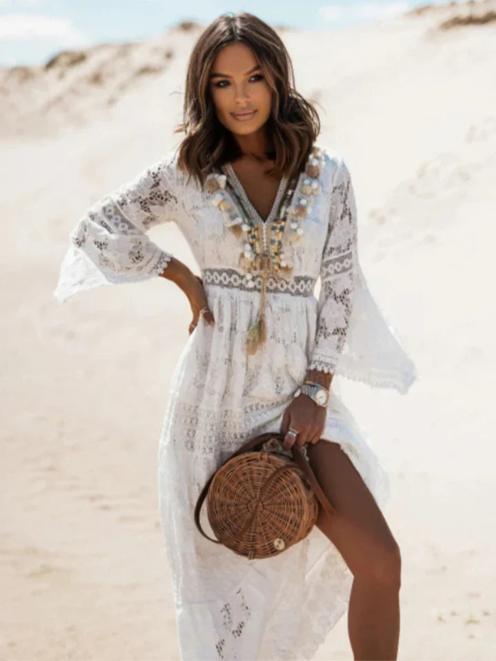 Women's bohemian maxi dress with elegant lace details & flowing flared sleeves. Perfect for summer or special occasions.