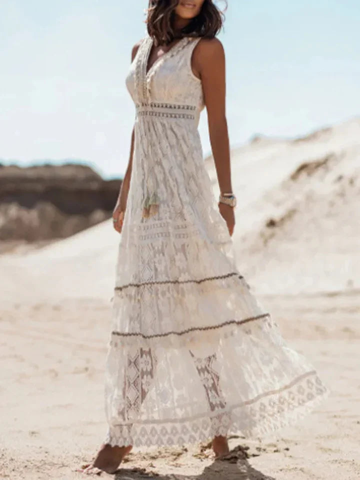 Stylish women's bohemian maxi dress with intricate lace and dramatic flared sleeves for a unique, elegant look.