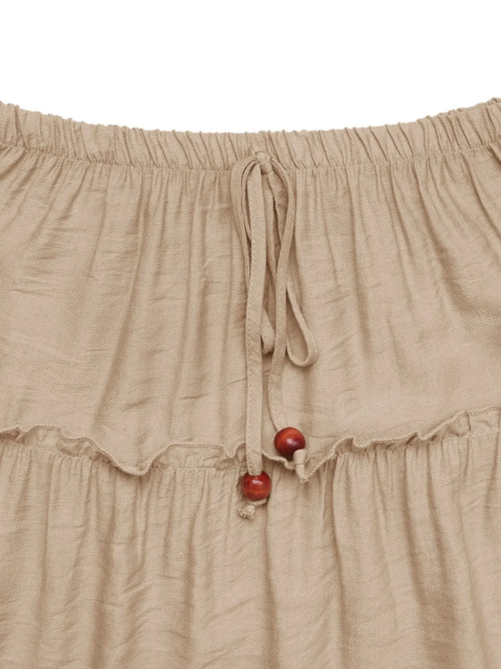 Comfortable women's flowing pleated maxi skirt in bohemian style, perfect for elegant summer and vacation outfits.