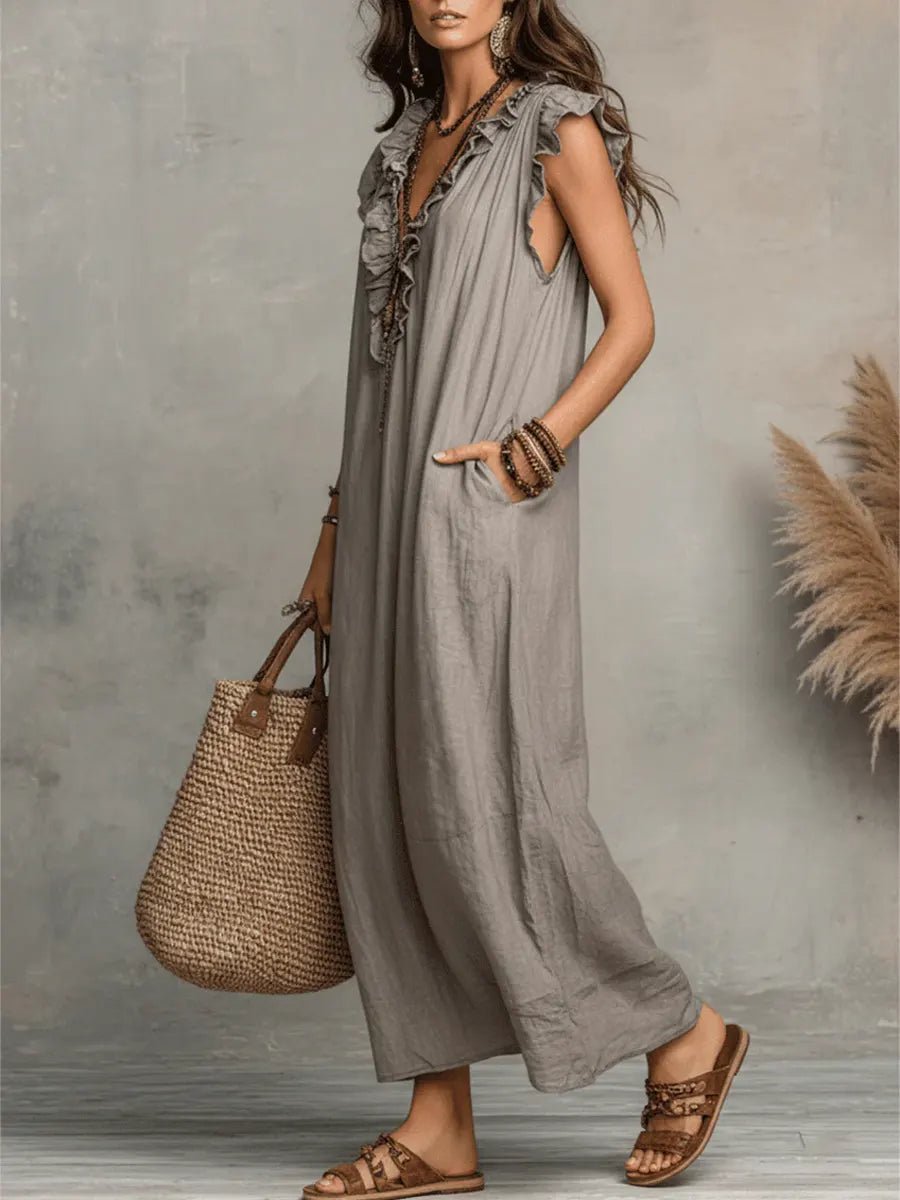 Full length of Women's Bohemian Maxi Dress, featuring Ruffle V-Neck and elegant Flutter Sleeves. Summer style.