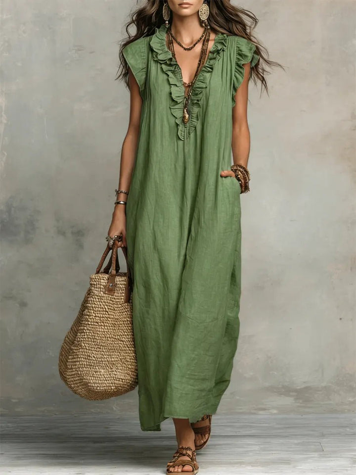 Elegant Women's Bohemian Maxi Dress featuring a Ruffle V-Neck and delicate Flutter Sleeves. Ideal for summer.