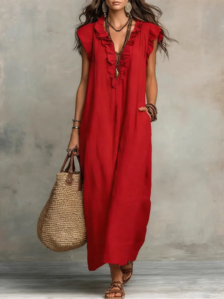 Flowy Women's Bohemian Maxi Dress, elegant Ruffle V-Neck & Flutter Sleeves. A perfect summer or vacation dress.