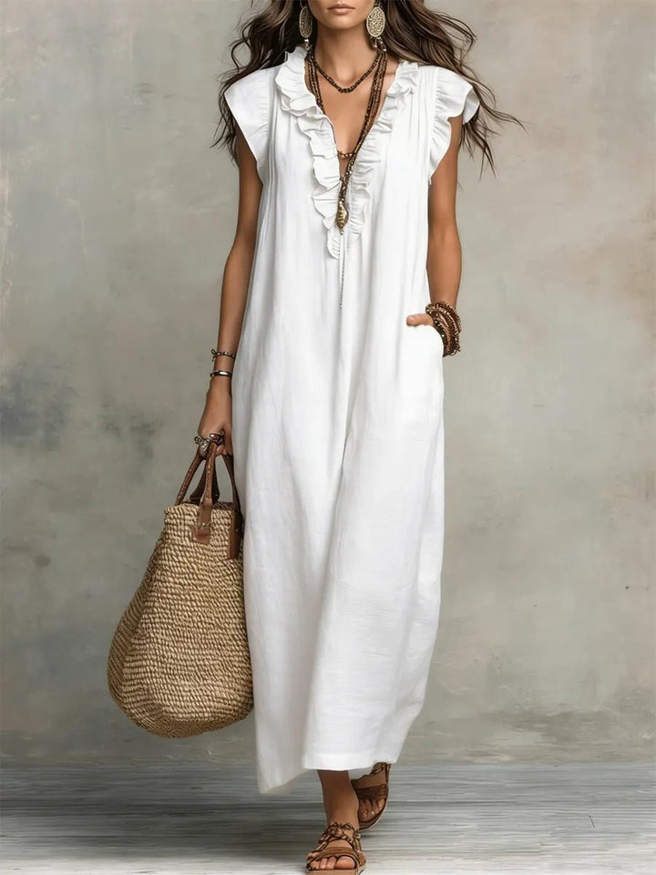 Comfortable Women's Bohemian Maxi Dress with V-Neck, ruffle details & flattering flutter sleeves. Day to evening.
