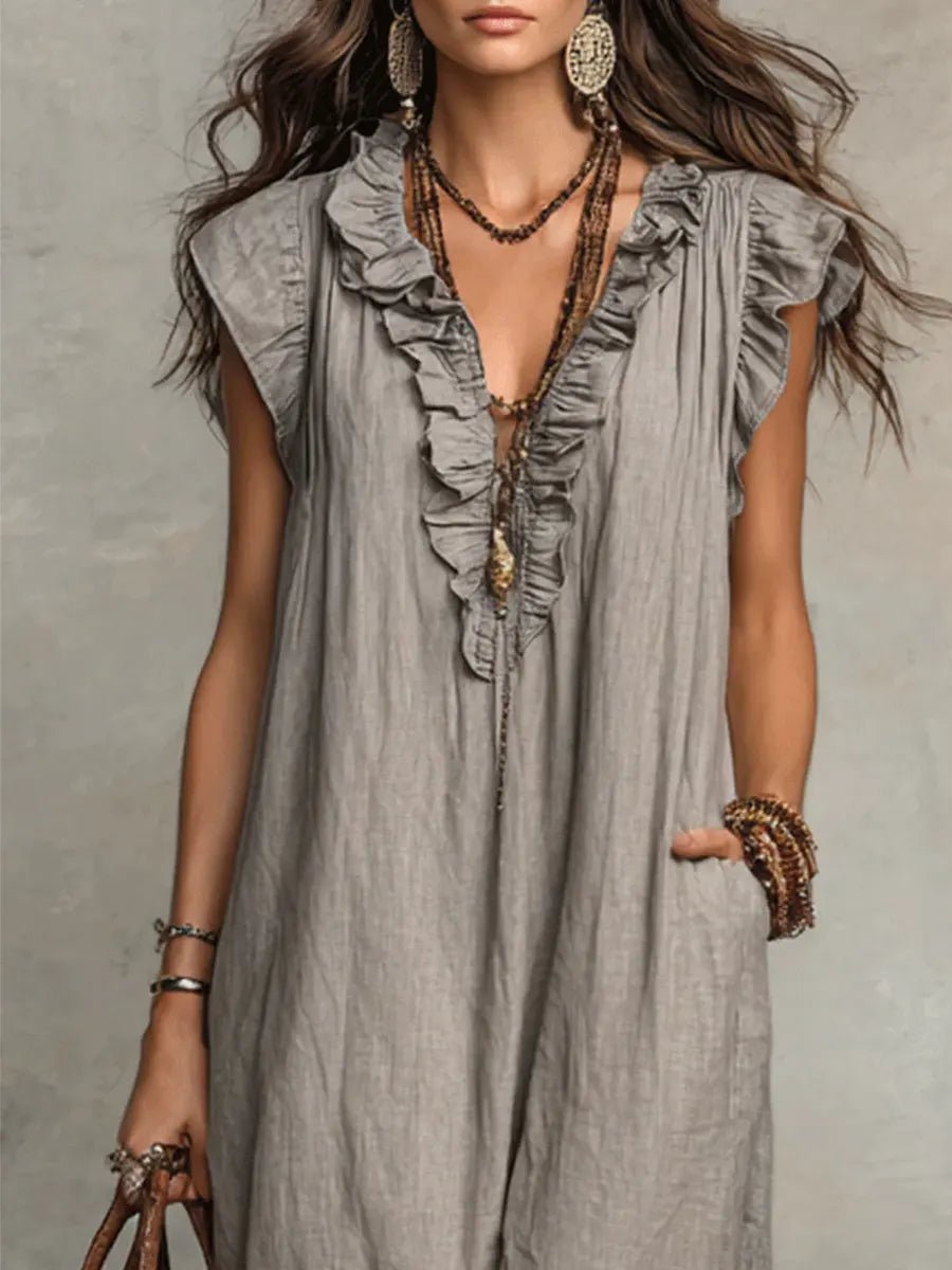 Vacation-ready Women's Bohemian Maxi Dress with a chic Ruffle V-Neck and graceful Flutter Sleeves.