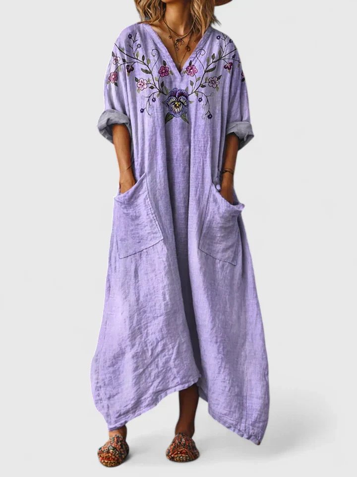 Elegant women's bohemian V-neck maxi dress. Soft cotton, flowy silhouette, and convenient pockets.