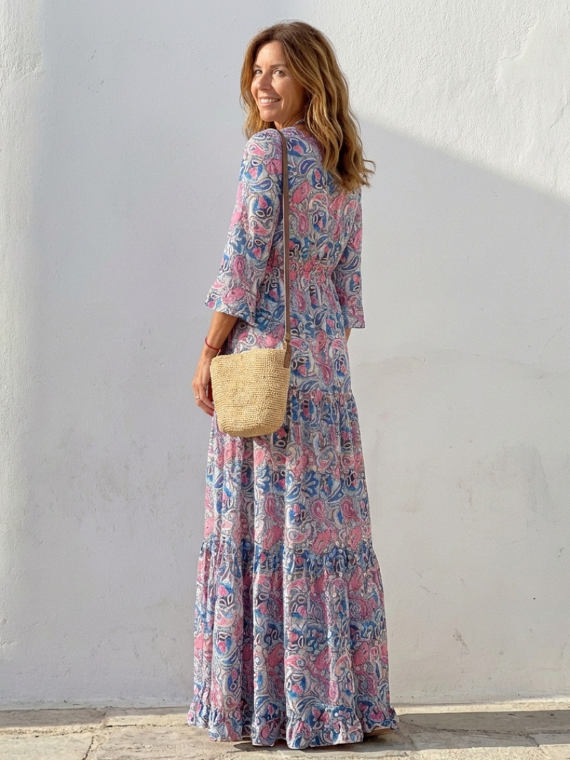 Elegant women's bohemian V-neck maxi dress, long sleeves, featuring a beautiful paisley print for travel or vacation.