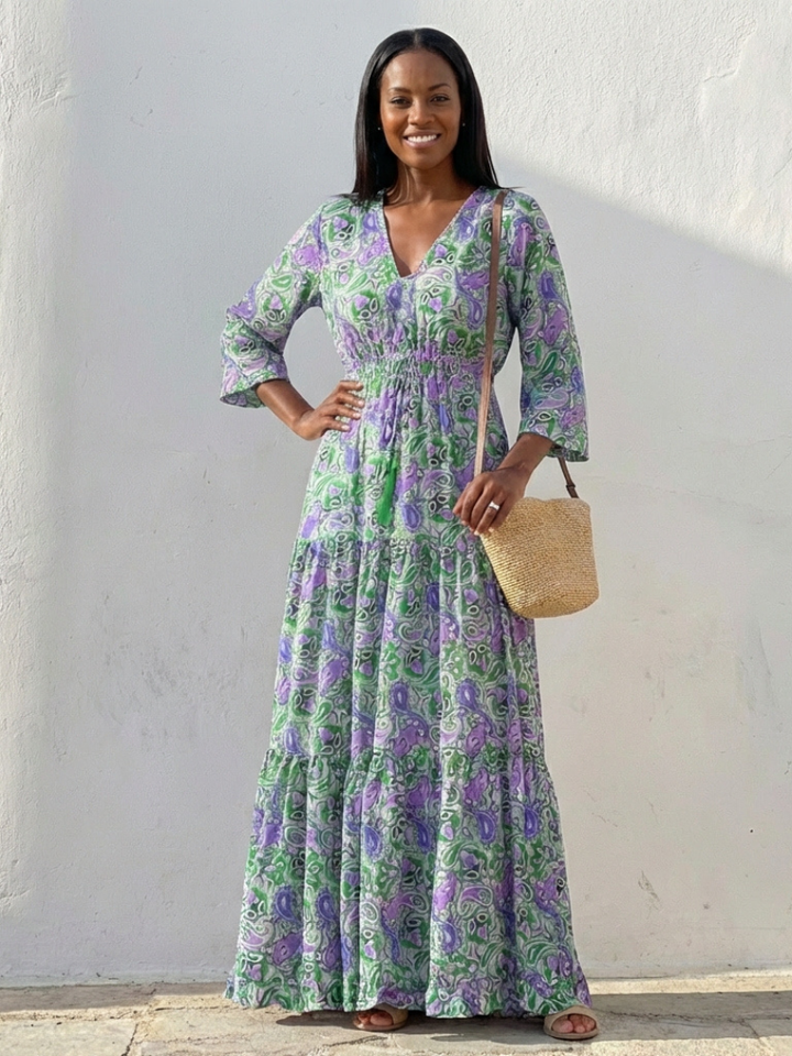 Versatile women's bohemian maxi dress, V-neck, long sleeves. Elegant flowy design for casual, travel, or beachwear.