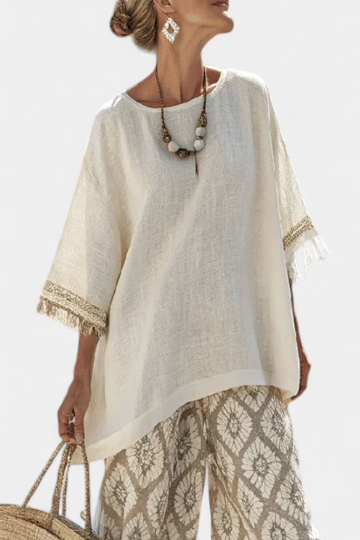 Stylish women's boho set featuring a fringe top & ethnic print wide leg trousers for comfortable summer & vacation outfits.