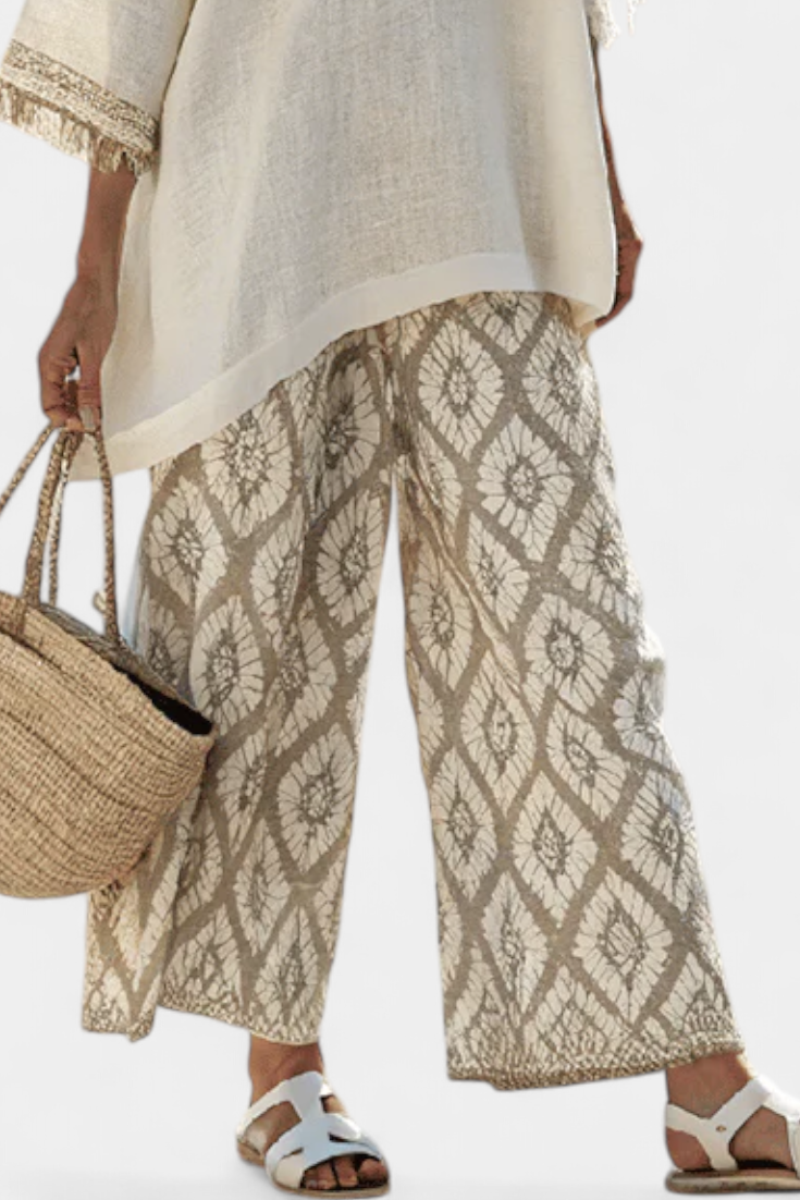 Comfortable women's two-piece boho chic set with stylish top & trousers, ideal for casual summer wear & holiday fashion.