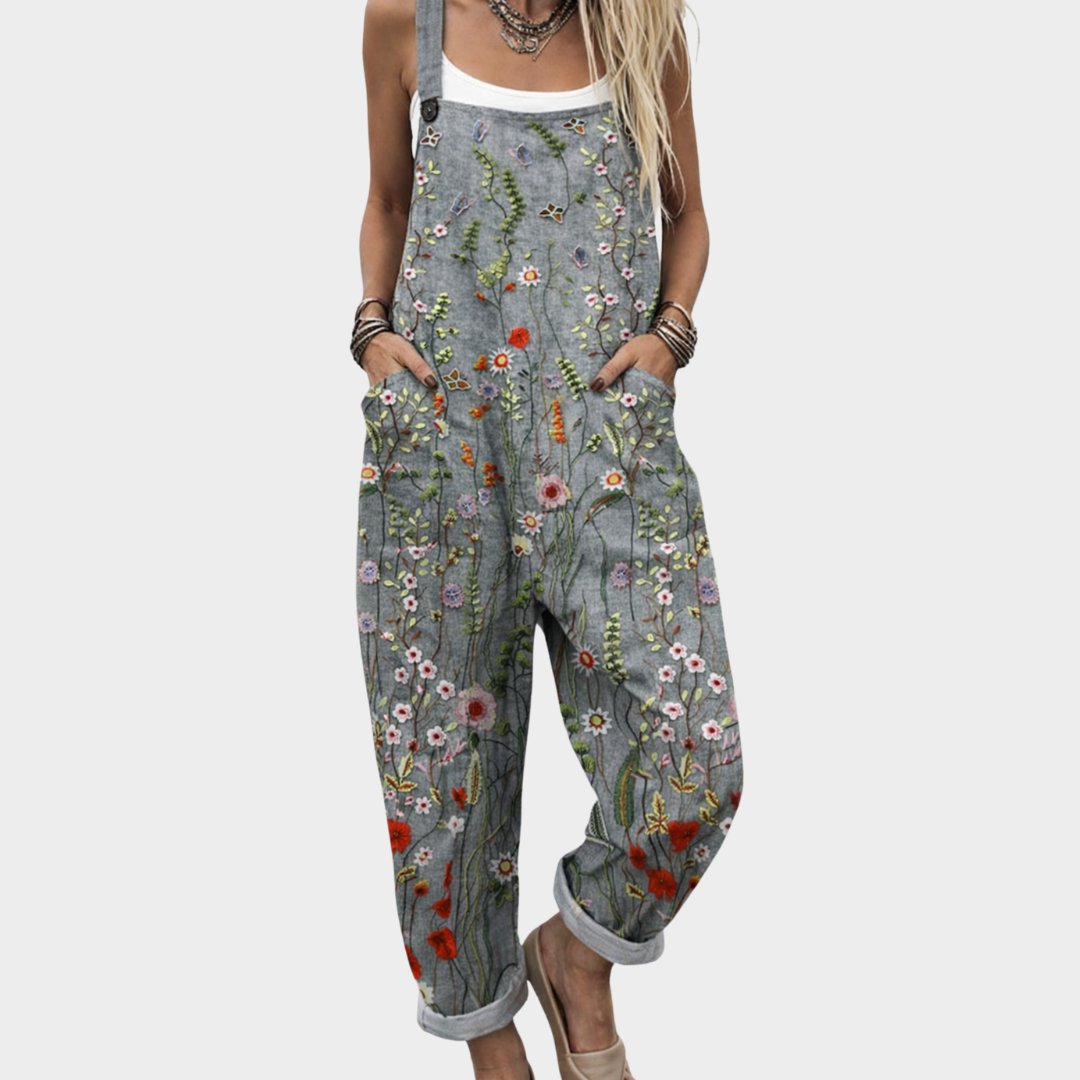 Women's boho floral embroidered dungaree jumpsuit with adjustable straps, relaxed fit, and pockets, ideal for summer festivals.