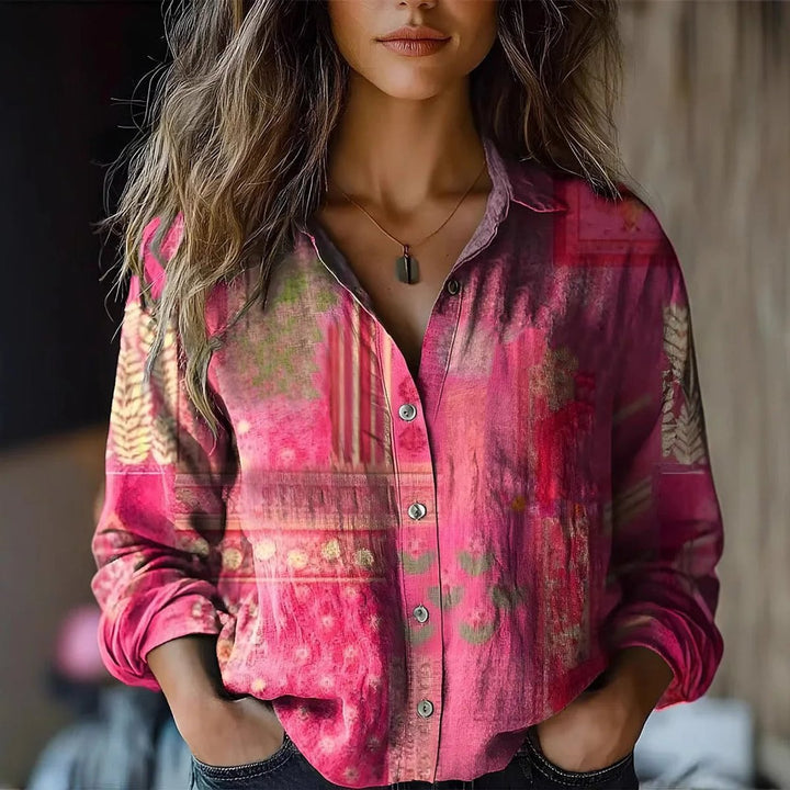 Bohemian women's long-sleeve blouse featuring a vibrant floral print and button-front closure.