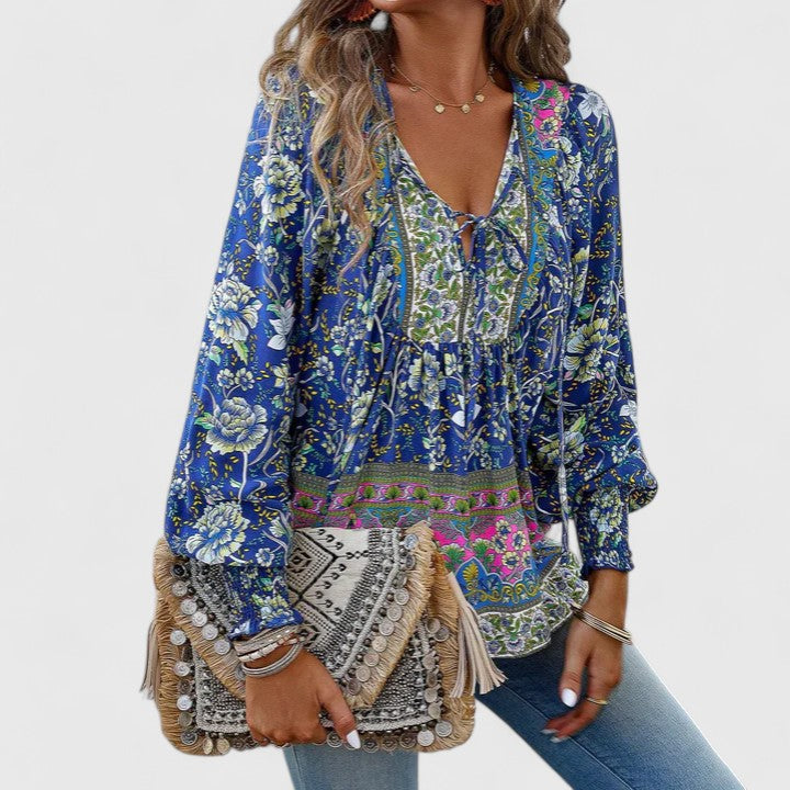 Floral print boho peasant top for women, featuring long sleeves and a relaxed fit, perfect for spring.