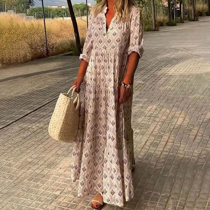 Flowy women's maxi floral dress featuring a V-neck and tiered bohemian skirt, great for a stylish summer look.