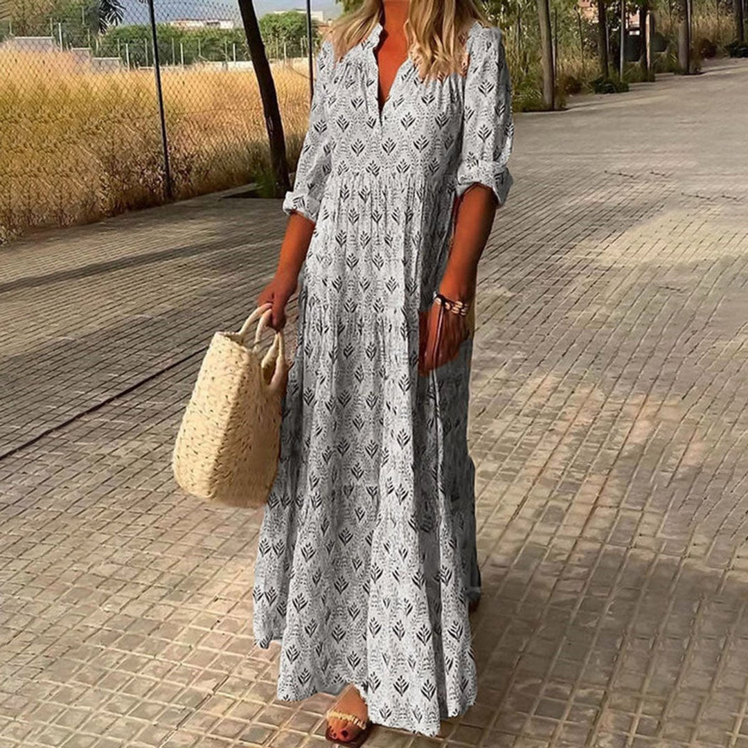 Stylish women's boho floral print maxi dress with V-neck & tiered flowy skirt, a chic choice for any party.