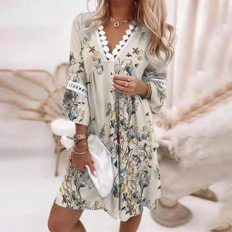 Vibrant floral print women's boho mini dress with V-neck, a chic and casual summer fashion statement.