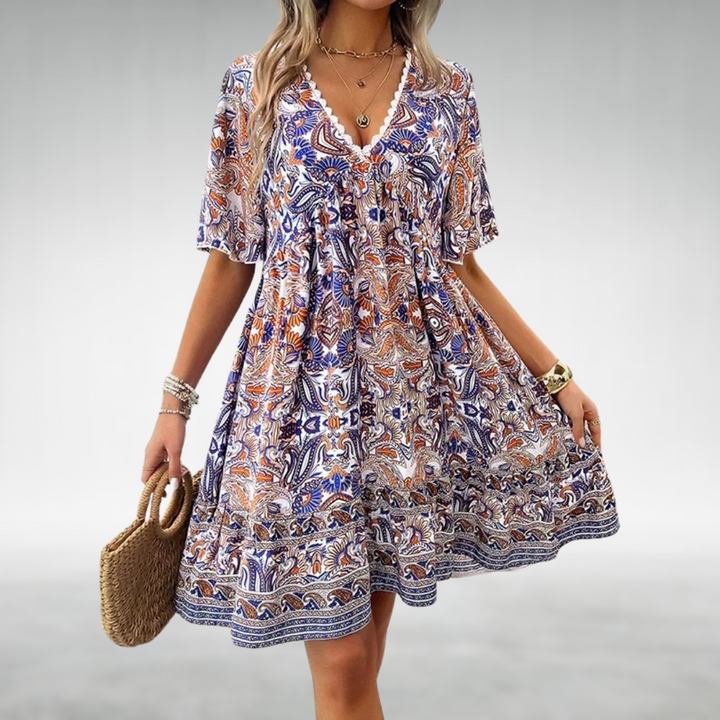 Stylish women's boho mini dress with a vibrant floral print and V-neck, ideal for summer casual wear or vacation.