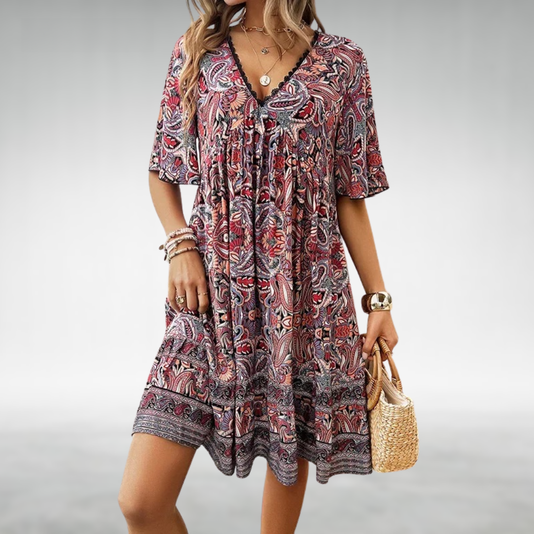 Front view of a chic women's floral boho mini dress. This V-neck summer casual dress has a flattering short cut.
