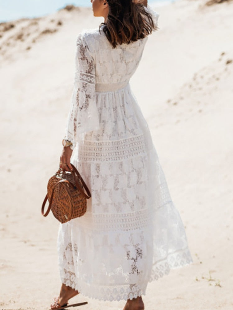 Vibrant women's boho maxi dress, flowing summer beachwear. Flattering sleeveless V-neck design.