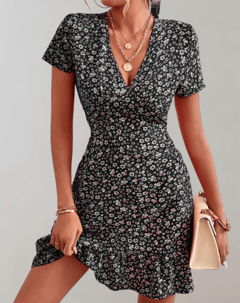 Elegant women's sleeveless boho midi dress featuring a beautiful floral print, ideal for summer, beach, or casual wear.