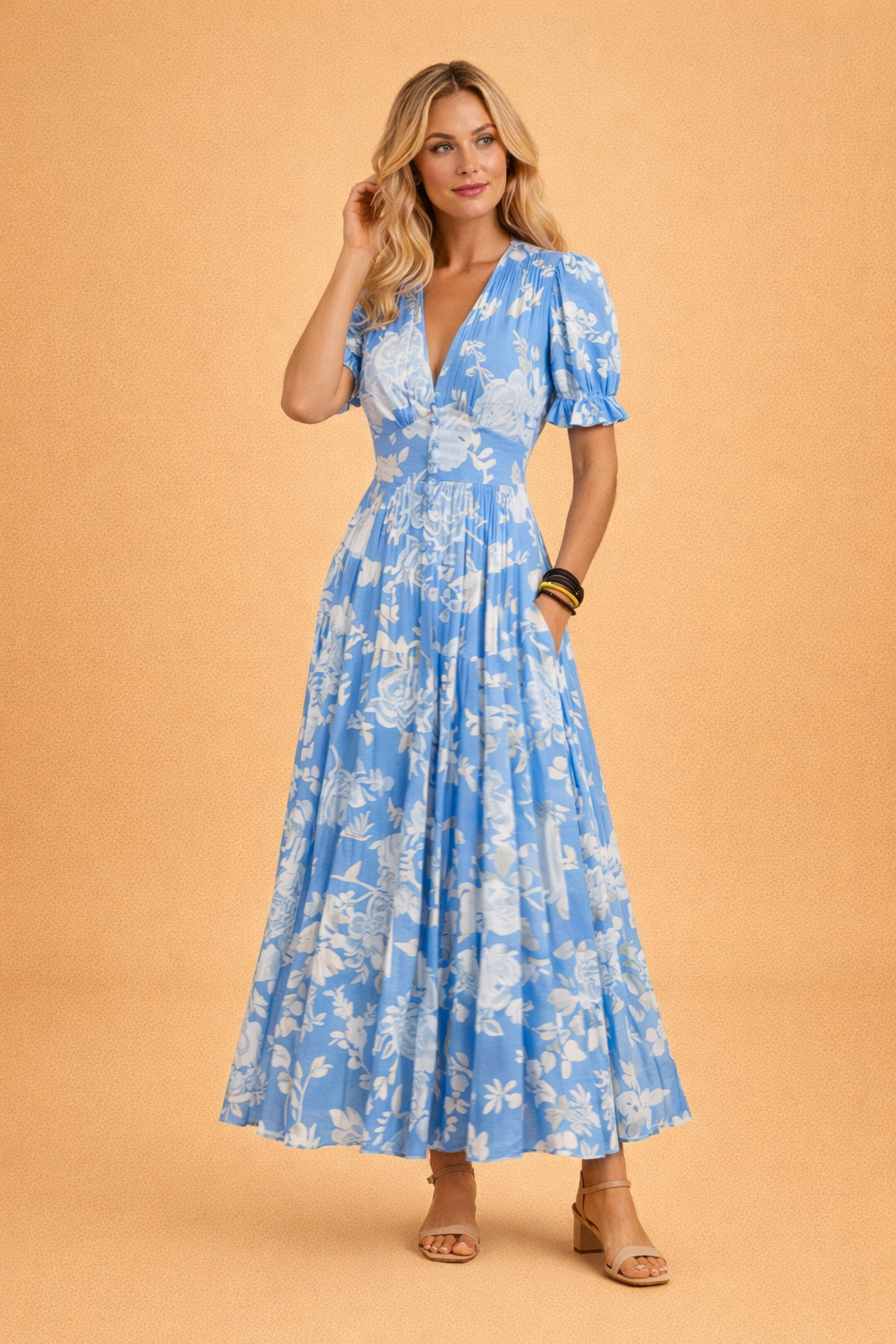Elegant women's sleeveless V-neck maxi dress with a vibrant floral print and flowy boho style.