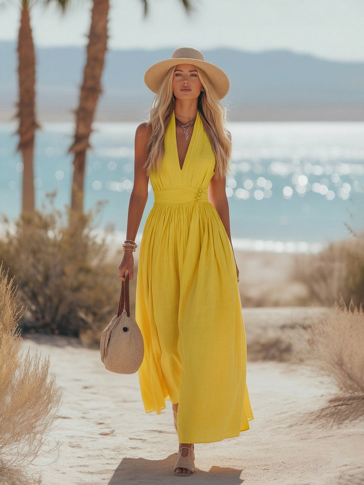 Sleeveless women's boho halter maxi dress. Flowy design for summer vacation & casual elegant wear.