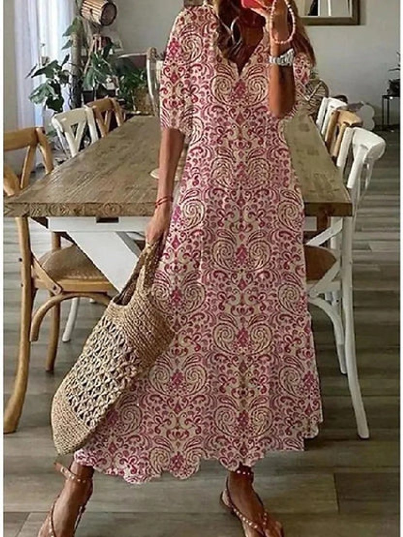 Vibrant ikat print women's midi dress. Boho style V-neck with playful tassels, perfect for summer vacations.