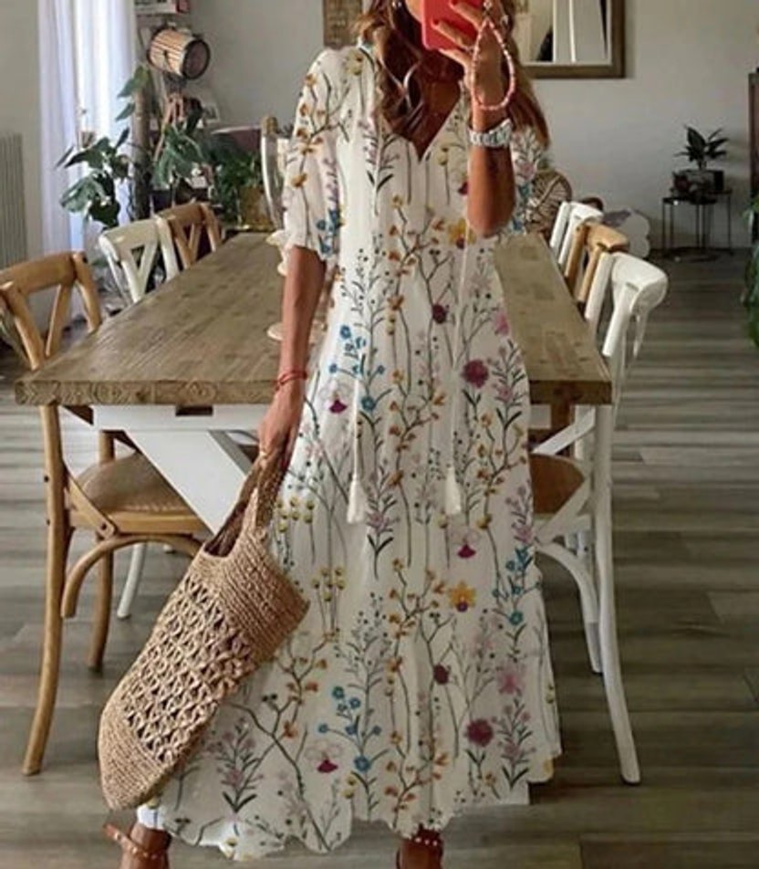 Elegant women's casual boho midi dress. Ikat print with V-neckline & tassel accents, flowy summer style.
