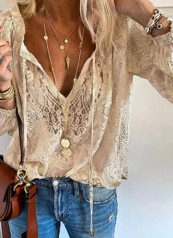 Women's deep V-neck long sleeve boho lace blouse. Stylish and versatile bohemian top for casual or elegant wear.