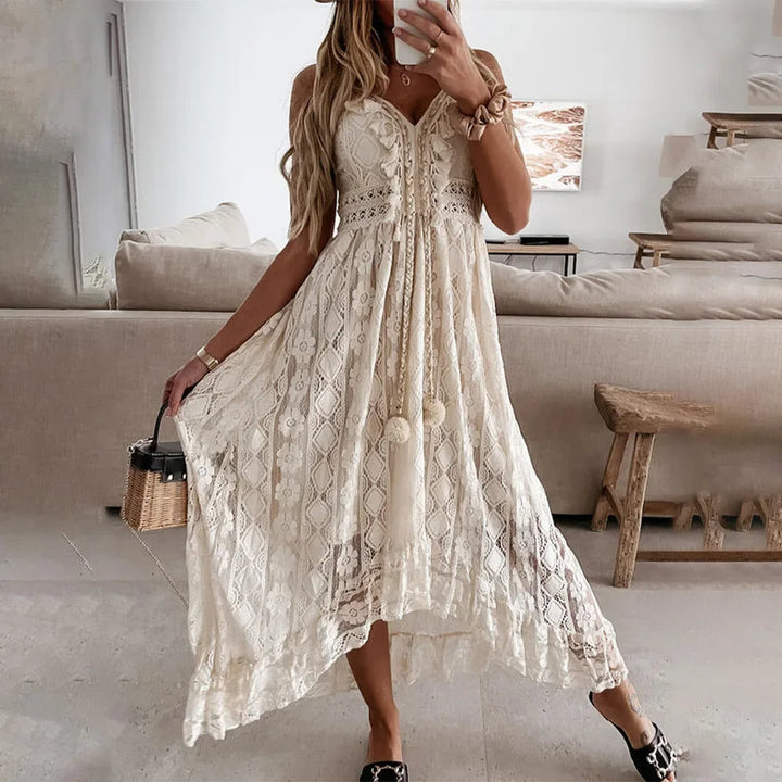 Effortless women's boho A-line lace dress with tie neck & tassels, ideal for casual summer fashion.
