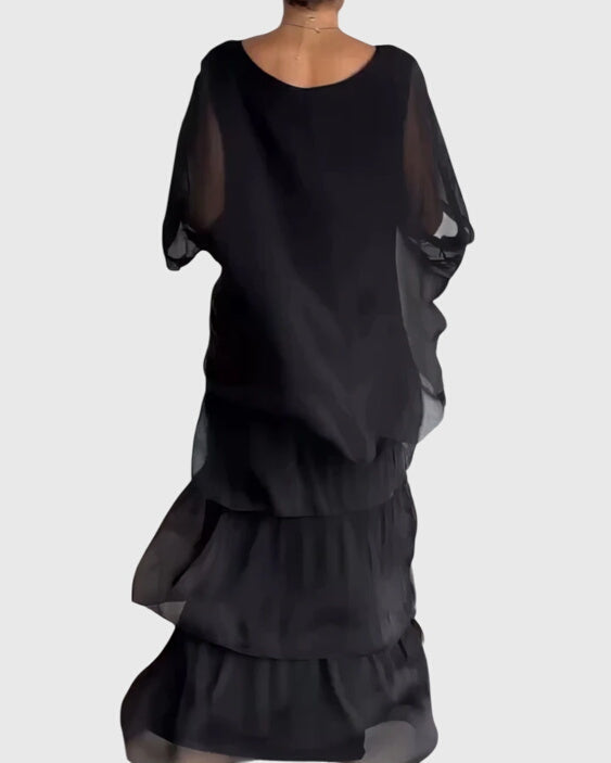Flowy bohemian layered maxi dress, perfect for casual summer outings.