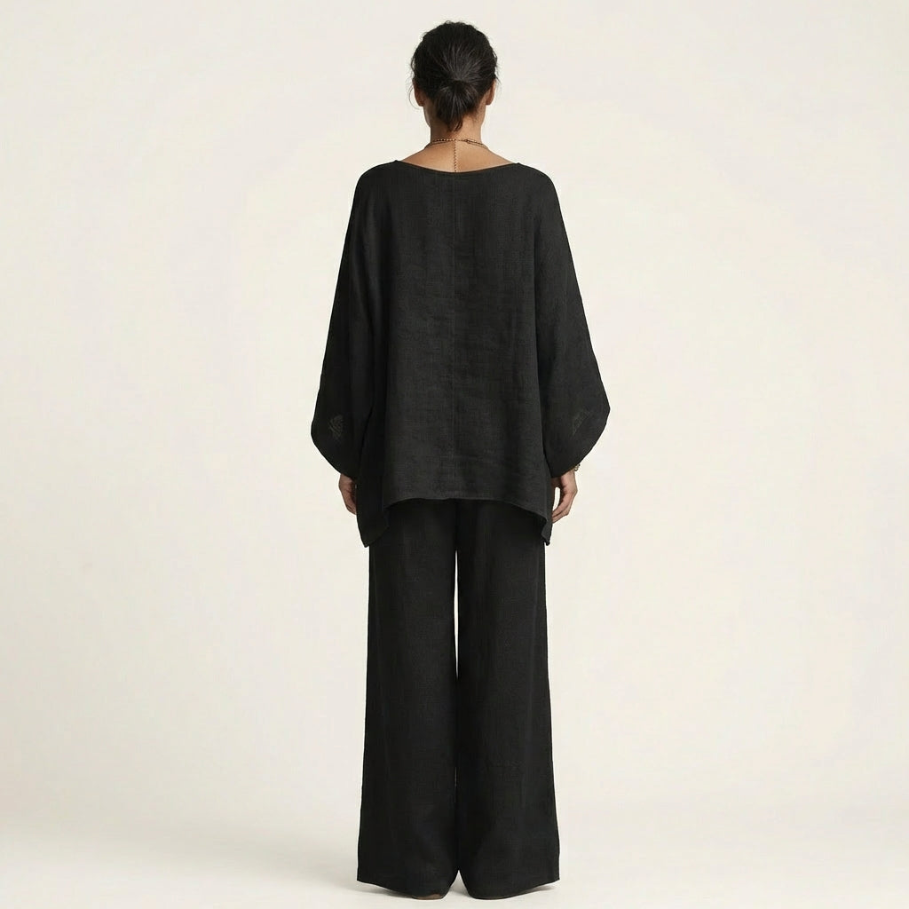 Complete women's boho linen blend two-piece set: a relaxed top & wide-leg pants for summer style.
