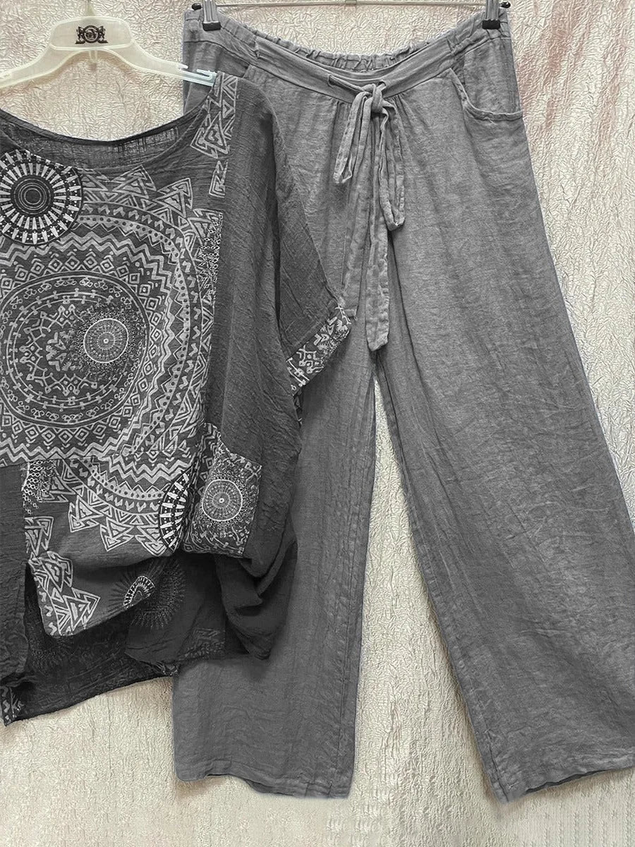 Comfortable women's co-ord set featuring a vibrant mandala print top and wide-leg drawstring waist pants.