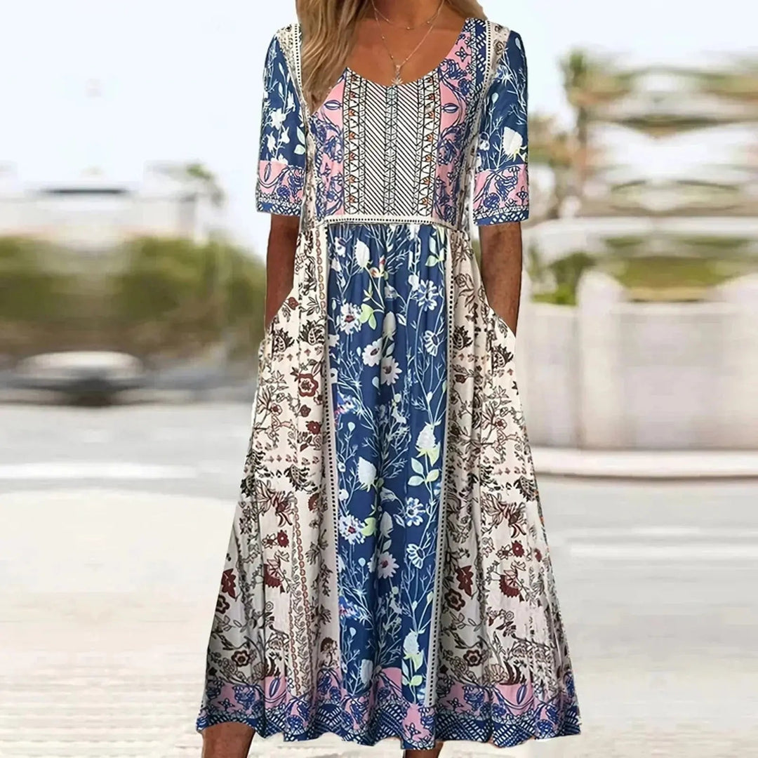 Flowing women's boho maxi dress, artistic print, round neck, short sleeve. Perfect casual summer or holiday style.
