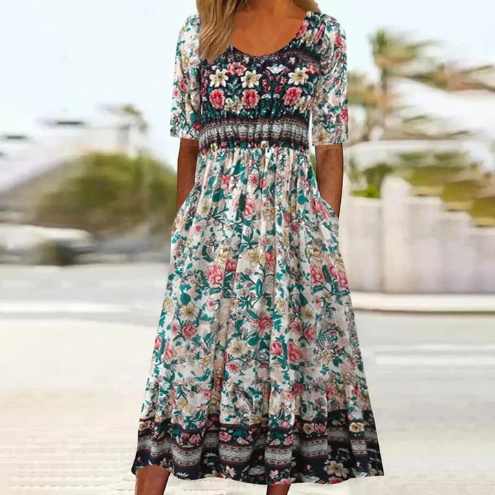 Bohemian women's maxi dress, round neck, short sleeve, flowing design. Comfortable and casual summer holiday wear.