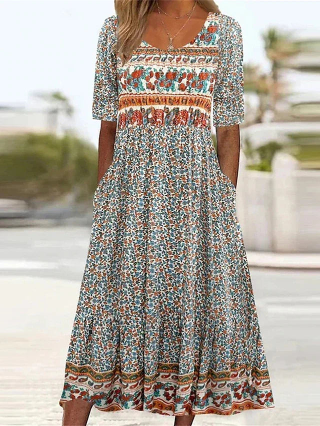 Women's boho midi dress with short sleeves, flowy printed design. Ideal summer casual bohemian day dress.